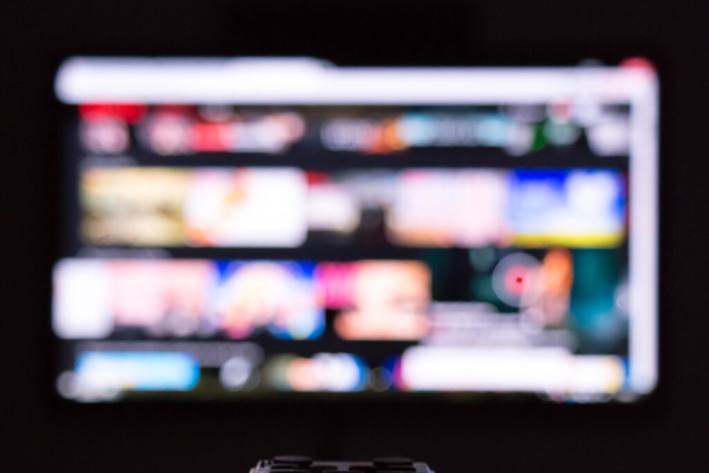 a remote control sitting in front of a television
