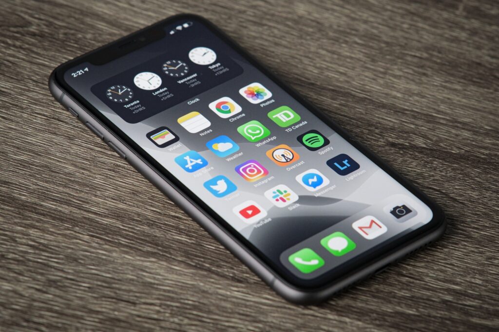 black iphone 5 on brown wooden table