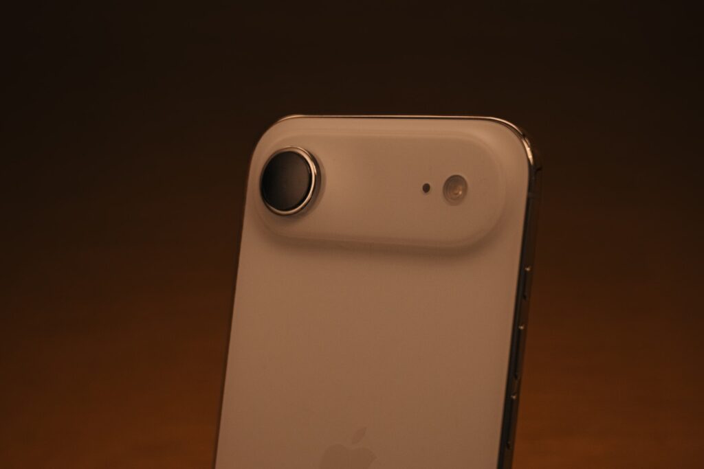 The iPhone Air is white and features a slim design, a clean finish, and minimalistic single-lens camera modules.